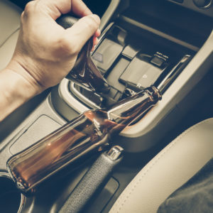 empty beer bottle in car