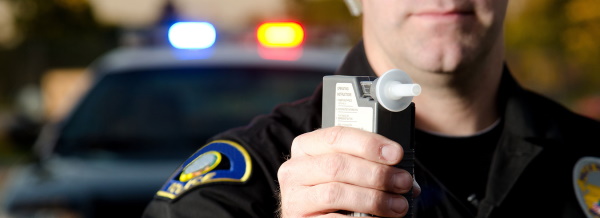 Officer holding Alcotest machine